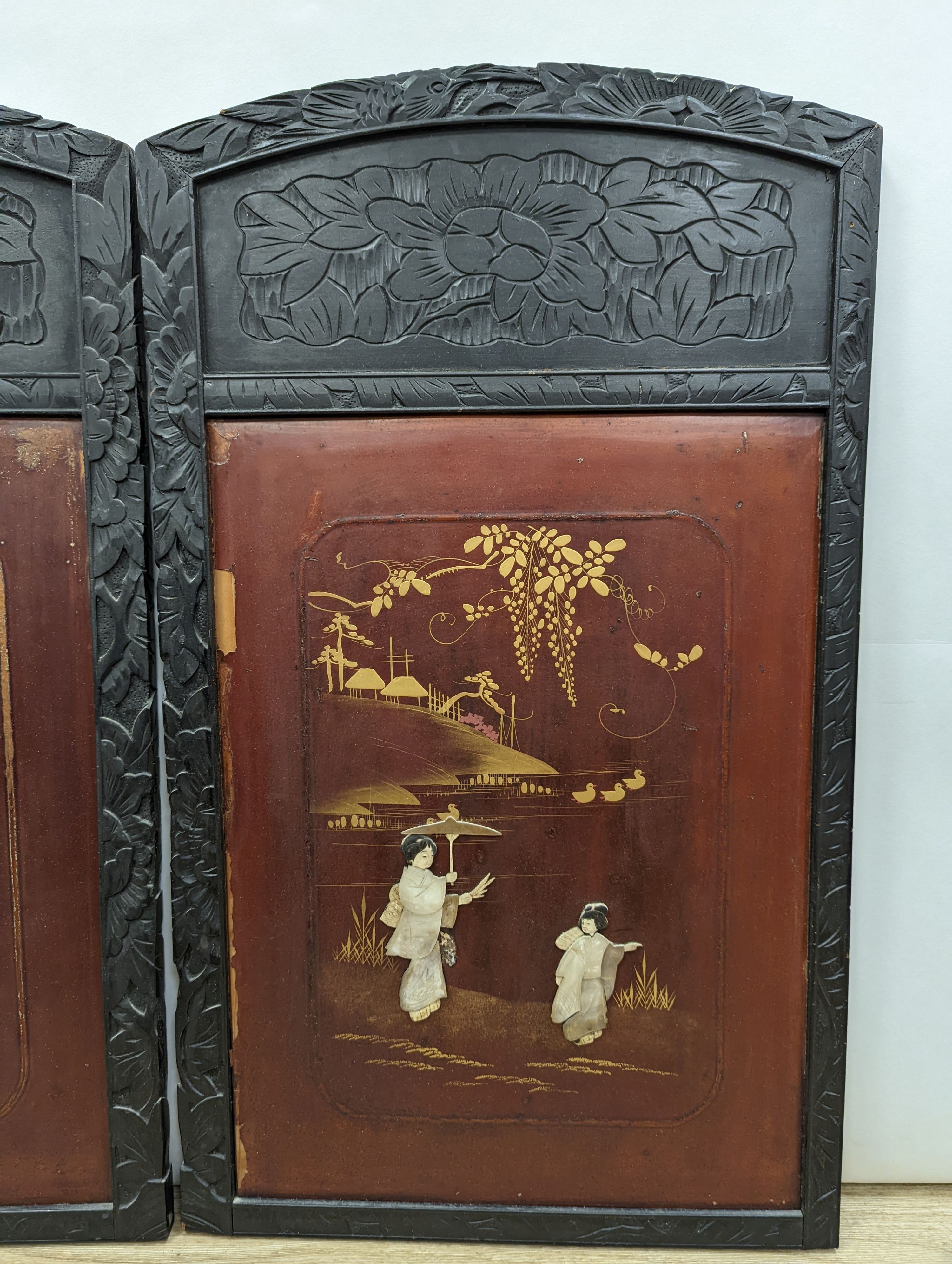 A pair Japanese bone and mother of pearl overlaid red lacquer panels, each 72 x 42.5 cm